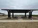 Community picnic area featuring a shaded pavilion with multiple tables, benches, and a welcoming space for residents at 15752 W Beryl Ave, Waddell, AZ 85355