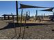 Community playground with shade, a picnic area, and lots of equipment for to enjoy at 15752 W Beryl Ave, Waddell, AZ 85355