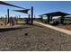 Community playground featuring a covered picnic area with tables and benches nearby at 15752 W Beryl Ave, Waddell, AZ 85355