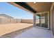 A covered patio extends into the backyard, complemented by a block wall fence at 15762 W Cheryl Dr, Waddell, AZ 85355