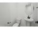Bathroom featuring a pedestal sink and toilet at 15762 W Cheryl Dr, Waddell, AZ 85355