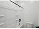 Bathroom showcasing modern bathtub shower with black shower head at 15762 W Cheryl Dr, Waddell, AZ 85355