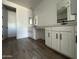 Bathroom featuring double sinks, modern fixtures, and white cabinetry at 15762 W Cheryl Dr, Waddell, AZ 85355