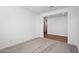 Bedroom showcasing neutral carpet and wood flooring in the entryway at 15762 W Cheryl Dr, Waddell, AZ 85355