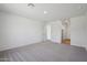 Spacious bedroom featuring plush carpeting, neutral walls, and ample natural light at 15762 W Cheryl Dr, Waddell, AZ 85355