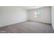Bright bedroom with carpeting and a window allowing for plenty of natural light at 15762 W Cheryl Dr, Waddell, AZ 85355