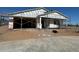 Under-construction home with visible frame, showcasing the building process and design at 15762 W Cheryl Dr, Waddell, AZ 85355