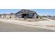 Lovely single-story home featuring a two-car garage, desert landscaping, and a welcoming entrance at 15762 W Cheryl Dr, Waddell, AZ 85355