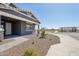 Charming property showcasing a covered porch and manicured landscaping, nestled in a desirable neighborhood at 15762 W Cheryl Dr, Waddell, AZ 85355