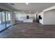 Open-concept kitchen featuring a large island, stainless steel appliances, and sliding glass doors at 15762 W Cheryl Dr, Waddell, AZ 85355