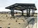 Shaded picnic area with modern metal tables and benches, perfect for community residents at 15762 W Cheryl Dr, Waddell, AZ 85355