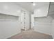 Bright walk-in closet showcases neutral carpet and shelving at 15762 W Cheryl Dr, Waddell, AZ 85355