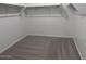 Walk-in closet with carpeting and shelving at 15762 W Cheryl Dr, Waddell, AZ 85355
