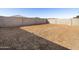 An empty backyard has been graded and is ready for landscaping at 15993 W Cottontail Ln, Surprise, AZ 85387