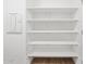 Bright and clean linen closet with wood-style flooring at 15993 W Cottontail Ln, Surprise, AZ 85387