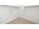 Empty walk-in closet with shelving and neutral carpeting at 15993 W Cottontail Ln, Surprise, AZ 85387