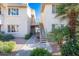 Exterior view of the building showcasing the well-maintained landscaping and common areas at 16013 S Desert Foothills Pkwy # 2077, Phoenix, AZ 85048