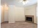 Cozy living room featuring neutral-colored walls, carpet, a tile fireplace, and an entrance to the front door at 16013 S Desert Foothills Pkwy # 2077, Phoenix, AZ 85048