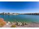 Relaxing view of the lake with waterfront residences, desert landscaping and clear blue skies for a peaceful outlook at 16013 S Desert Foothills Pkwy # 2077, Phoenix, AZ 85048