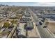 Aerial view of commercial and residential area with clear roads, adjacent parking lots, and city skyline visible at 1610 W Buckeye Rd, Phoenix, AZ 85007