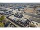 The aerial view captures a commercial building with an expansive parking area and a bustling city street at 1610 W Buckeye Rd, Phoenix, AZ 85007