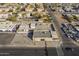 Aerial view of a commercial building with an expansive parking area and neighboring residential properties at 1610 W Buckeye Rd, Phoenix, AZ 85007