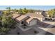 Aerial view of a single-Gathering home displaying a tile roof, landscaped yard, and a two-car garage at 16412 N 168Th Ln, Surprise, AZ 85388