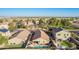 Charming aerial view of homes with pools and lush landscaping in a desirable neighborhood at 16412 N 168Th Ln, Surprise, AZ 85388