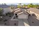 Aerial view of a home showing the roof, driveway, and landscaping in a residential neighborhood at 16412 N 168Th Ln, Surprise, AZ 85388