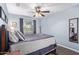 Comfortable bedroom featuring a queen-sized bed, soft bedding, and natural light from the window at 16412 N 168Th Ln, Surprise, AZ 85388