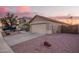 Well-maintained single-story home exterior featuring desert landscaping, a two-car garage, and a tile roof at 16412 N 168Th Ln, Surprise, AZ 85388