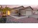 Charming single-story home with manicured desert landscaping and a two-car garage at 16412 N 168Th Ln, Surprise, AZ 85388