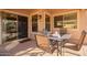 Inviting covered patio showcasing a dining table and chairs, ideal for enjoying meals outdoors at 16412 N 168Th Ln, Surprise, AZ 85388