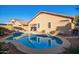 Gorgeous pool with a unique shape, surrounded by lush landscaping and offering a private oasis at 16412 N 168Th Ln, Surprise, AZ 85388