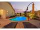 Serene backyard showcasing a private pool, lounge chairs, and lush landscaping at 16412 N 168Th Ln, Surprise, AZ 85388