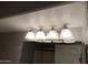 Bathroom vanity mirror with four bulb lighting fixture above at 16631 E El Lago Blvd # 214, Fountain Hills, AZ 85268