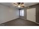 Neutral bedroom features a ceiling fan and a closet with sliding doors at 16631 E El Lago Blvd # 214, Fountain Hills, AZ 85268