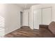 Clean bedroom with sleek hardwood floors, closet and a doorway into the connected bathroom at 16643 N 19Th St, Phoenix, AZ 85022