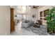 Open-concept living room featuring tile floors, neutral colors, and built-in shelving in this well-lit, modern home at 16643 N 19Th St, Phoenix, AZ 85022