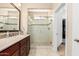 Bathroom featuring glass shower, updated fixtures, and a neutral color palette at 16713 W Monte Vista Rd, Goodyear, AZ 85395