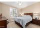 Bedroom with a ceiling fan, plantation shutters, and carpeted floor at 16713 W Monte Vista Rd, Goodyear, AZ 85395