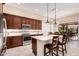 Stunning kitchen with stainless appliances, a tile backsplash, and quartz countertops at 16713 W Monte Vista Rd, Goodyear, AZ 85395