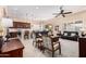 Spacious living room with ceiling fan, recessed lighting, and an open-concept layout to the kitchen and dining room at 16713 W Monte Vista Rd, Goodyear, AZ 85395