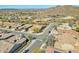 A scenic aerial view of the neighborhood showcasing desert landscaping, mountain views, and nearby roads at 1728 W Eagle Talon Trl, Phoenix, AZ 85085