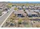 A beautiful aerial view of a home with desert landscaping, fenced yard, and tile roof in a suburban neighborhood at 1728 W Eagle Talon Trl, Phoenix, AZ 85085