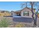 Spacious backyard featuring desert landscaping, a covered patio, and privacy fencing at 1728 W Eagle Talon Trl, Phoenix, AZ 85085