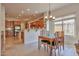 Bright dining room with a wooden table and a window offering natural light at 1728 W Eagle Talon Trl, Phoenix, AZ 85085