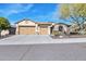 Attractive single-story home with a three-car garage and manicured front yard at 1728 W Eagle Talon Trl, Phoenix, AZ 85085