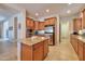 Kitchen with a center island, stainless steel appliances, and ample cabinet space at 1728 W Eagle Talon Trl, Phoenix, AZ 85085