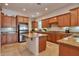 Spacious kitchen with custom cabinets, granite countertops, and stainless steel appliances at 1728 W Eagle Talon Trl, Phoenix, AZ 85085